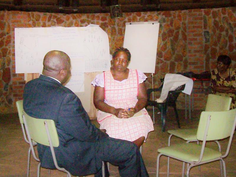 Face to face policy debate - firewood seller and Director of Forestry, Zimbabwe